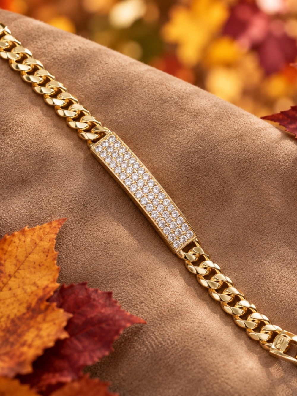 Cuban Link gold bracelet with CZ band accent stones